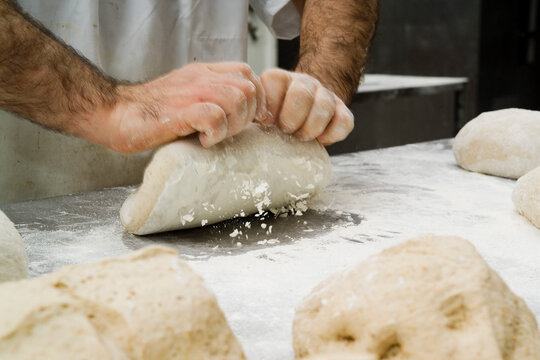 Baker's Hands Kneading Dough