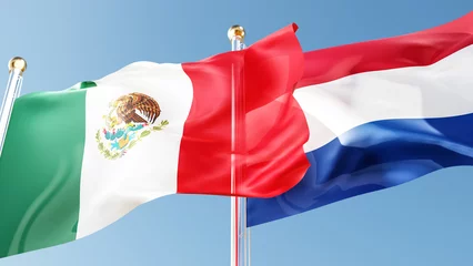 Fotobehang mexico and netherlands flags waving in the wind against a blue sky. mexican, holland national symbols 3d rendering © Сергей Шиманович
