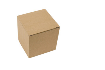 Closed small brown corrugated cardboard box without print, eco-friendly packaging for small items on white background