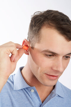 Man Wearing Earplugs