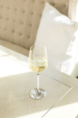 Isolated closeup glass of white wine in luxurious lifestyle home environment