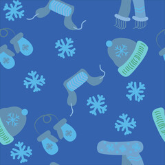 Naklejka premium Seamless pattern with a winter hat, scarf, mittens on a tie. Vector illustration on a blue background.
