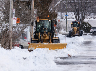 snowplow cleaning a street