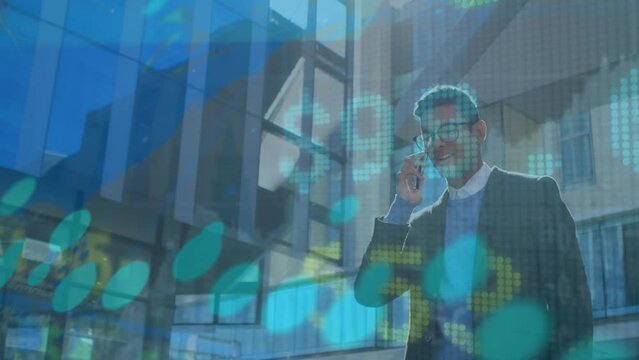 Animation of data processing over biracial businessman talking on smartphone