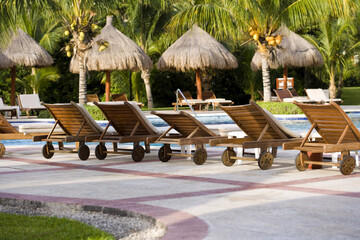 Pool Chairs Lined Up Beside Pool