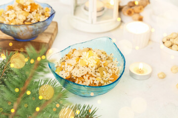 Bowl of traditional rice Kutya dish on light table