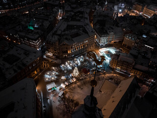 Obraz premium Aerial night view of the winter Riga old town - the capital of Latvia. Beautiful winter over Riga.