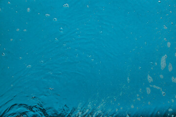 Water with bubbles on color background