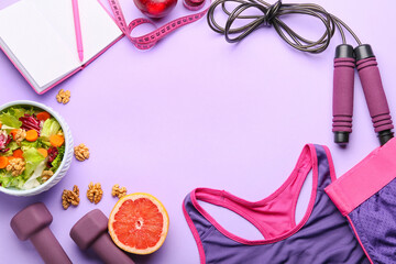 Frame made of healthy food, sports equipment and clothes on color background