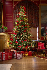 Lovely Christmas Tree and Gift Boxes with Nutcracker in a Cosy Room