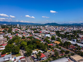 Beautiful aerial view of the City of San Salvador, capital of El Salvador - Its cathedrals and buildings - obrazy, fototapety, plakaty