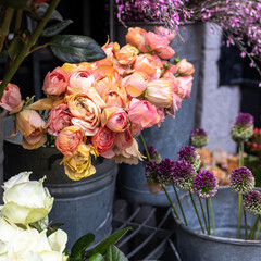 A variety of colors near the Liberty store in London. Large bouquets in tin vases.
