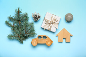 Composition with Christmas decorations, gift box and fir branches on color background