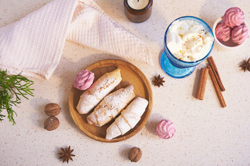 Cozy home with warm handmade Christmas crescent bagels and marshmallow with Viennese coffee.