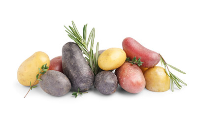 Heap of different raw potatoes and fresh herbs on white background
