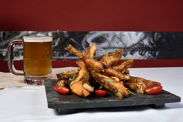 fried fish strips served on stone