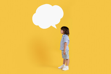 Kids thoughts. Full length shot of little boy with speech bubble expressing his thoughts, empty space