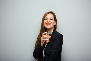 Happy woman holding water glass. isolated female portrait with black suit.