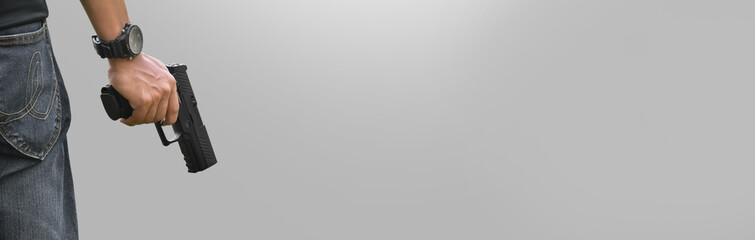 Isolated 9mm pistol gun holding in right hand of gun shooter with clipping paths, copy space.