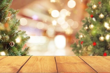 Fototapeta na wymiar Wooden empty table and Christmas tree background
