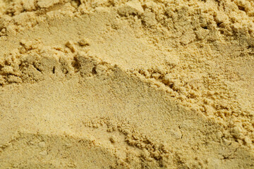 Aromatic mustard powder as background, top view