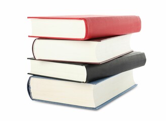 Many different books stacked on white background