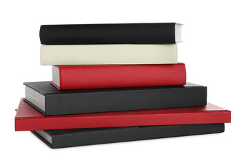 Stack of different books on white background