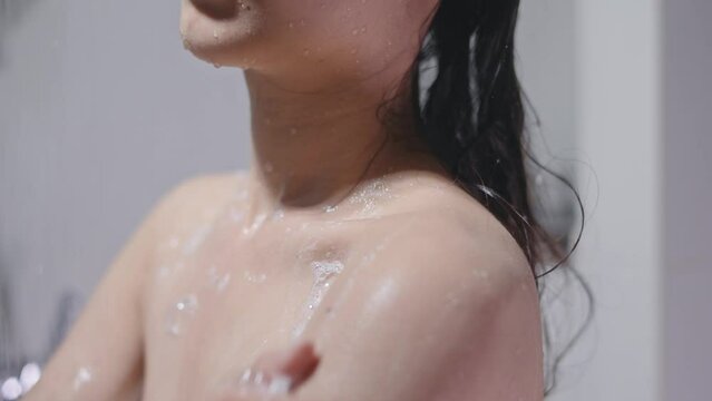 She rubbed soap across her chest.