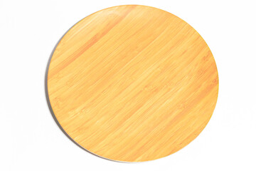 A wooden biodegradable plate on a white background