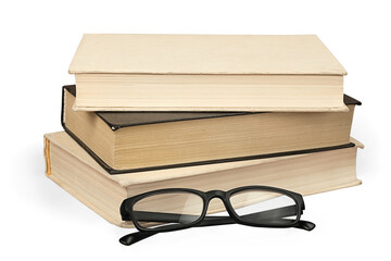 Stack of study books and reading glasses