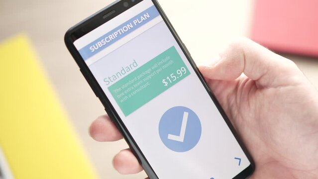Choosing a Subscription Plan on a Smartphone App Closeup