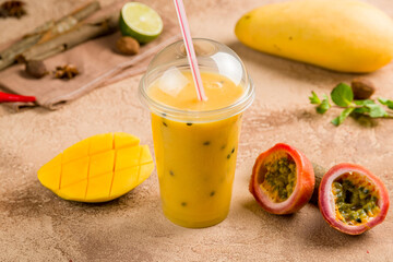 mango passion fruit smoothie on brown table, Vietnamese cuisine