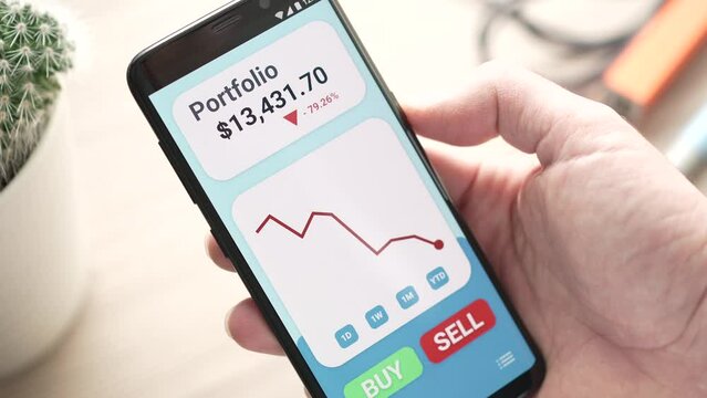 Stock Market Portfolio Going Down With Red Graph on Smartphone app