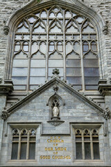 Close-up view of Cathedral front exterior in the morning with cloudy sky. No people. High-quality photo