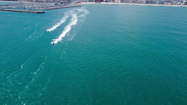 Aerial view of the mediterranean sea with jetski's passing by in Carnon, Montpellier, France.