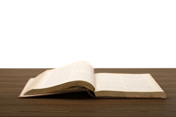 Open book or magazine on wooden desk