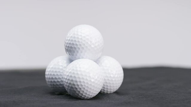 white golf balls in studio