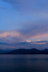 sunset on Dermaga Cinta Beach, Banyuwangi. Sunset with view of Bali Island. Sunset over the sea.