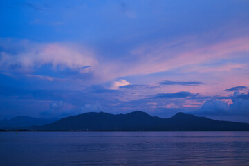 sunset on Dermaga Cinta Beach, Banyuwangi. Sunset with view of Bali Island. Sunset over the sea.
