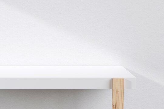 Sunlit white wooden table shelf with shadow on white wall for Minimal scenes for trade shows, fashion, cosmetics, or other products, 3D rendering.