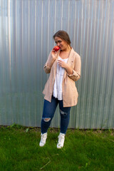 young beautiful woman in a jacket and jeans