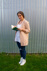 young beautiful woman in a jacket and jeans