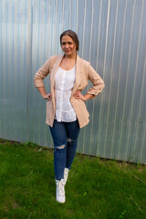 young beautiful woman in a jacket and jeans