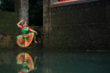 Beautiful Indian female dancer in the posture of Indian dance . Indian classical dance Bharatanatyam