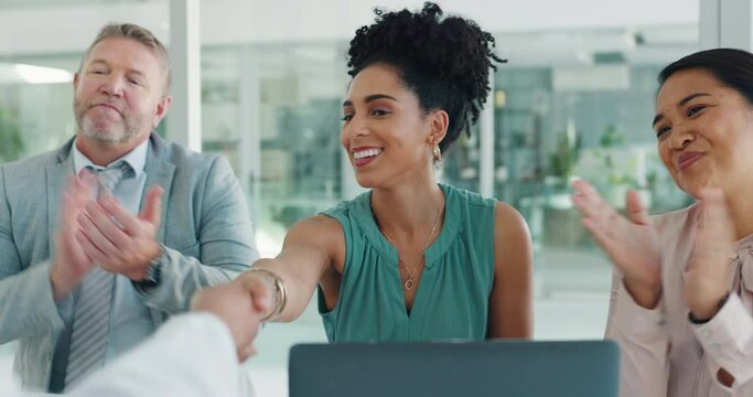 Handshake, deal and business people clapping to celebrate success, good news or partnership. Meeting, discussion and women shaking hands with their team giving an applause in the office boardroom.