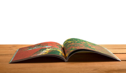 Open reading book on a wooden desk