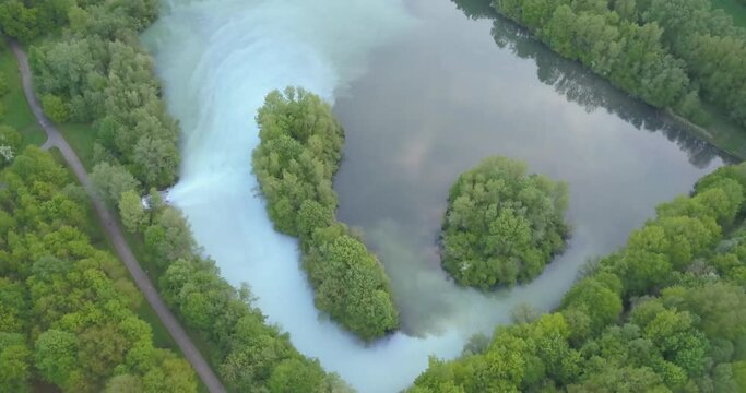 Bochum werne, Germany. Lush green forest and turquoise lake waters. drone view.