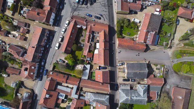 Topdown Aerial Drone Shot Flying Over Beautiful Old Burnham Market Village on Sunny Day in North Norfolk UK