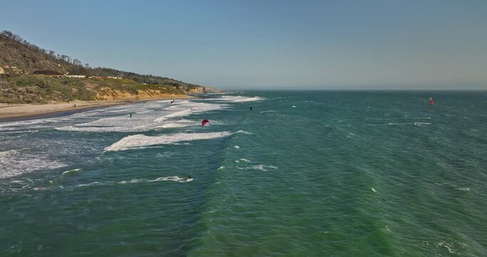 Davenport California Aerial v1 drone fly around waddell beach capturing post bushfire landscape with kite boarders surfing the wind, flying high in the sky - Shot with Mavic 3 Cine - May 2022