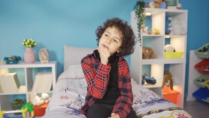 A smart kid comes up with a new idea.
A thinking child comes up with a new idea and dances happily.
